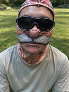 Old-man mask shown when worn